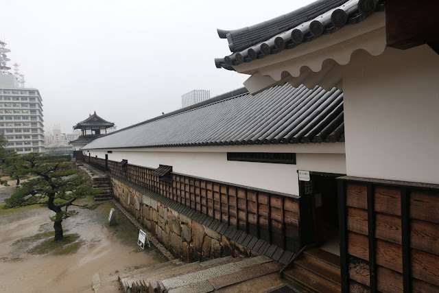 Looking at the walls of Ninomaru Omote Gate and the garden from inside at Hiroshima Castle and Tower in Japan Looking at the walls of Ninomaru Omote Gate and the garden from inside at Hiroshima Castle and Tower in Japan