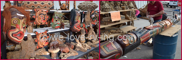 many masks, totem pole and carvings on display