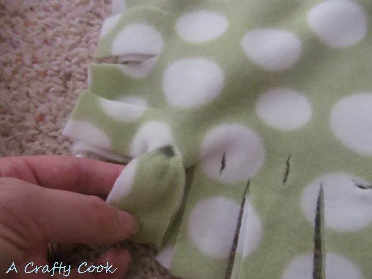 A Crafty Cook No Sew, No Knot Fringe Fleece Blanket and Pillow Cover