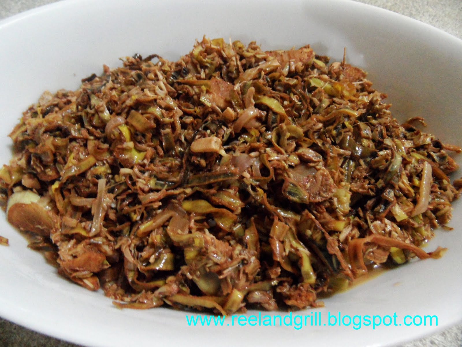 Reel And Grill Sisig Or Kilawing Puso Ng Saging Sauteed Banana Bud Blossom With Vinegar