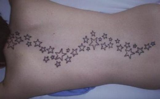 tattoos of stars on back. Well my guess is this person is a fan of the star tattoo and tis a 