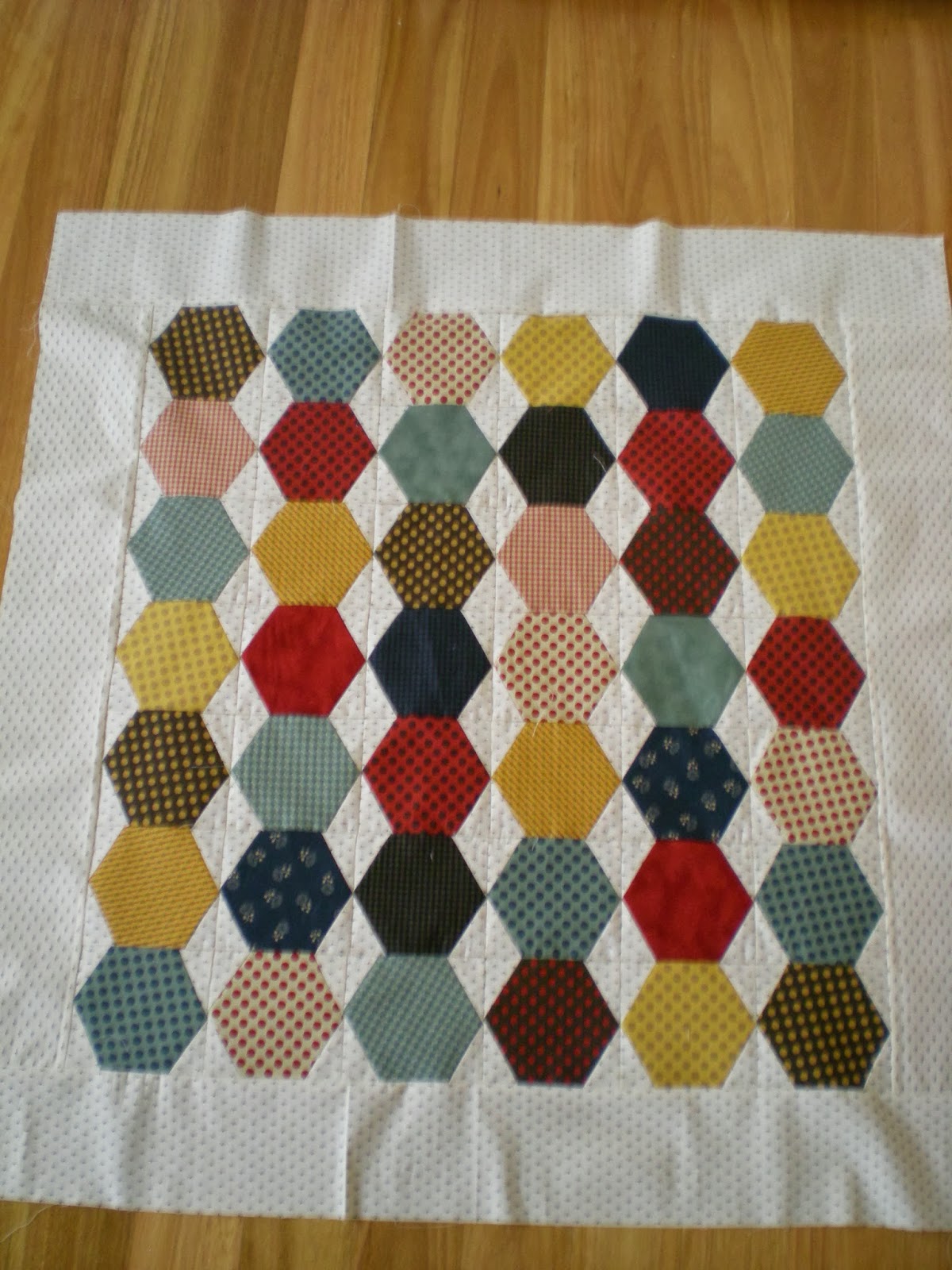 A Little Stitching Hexagon table topper.
