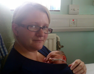 Mum with premature baby in NICU intensive care
