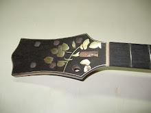 headstock inlay with gold, bronze & brass