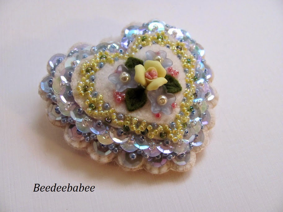 blue and yellow heart pin