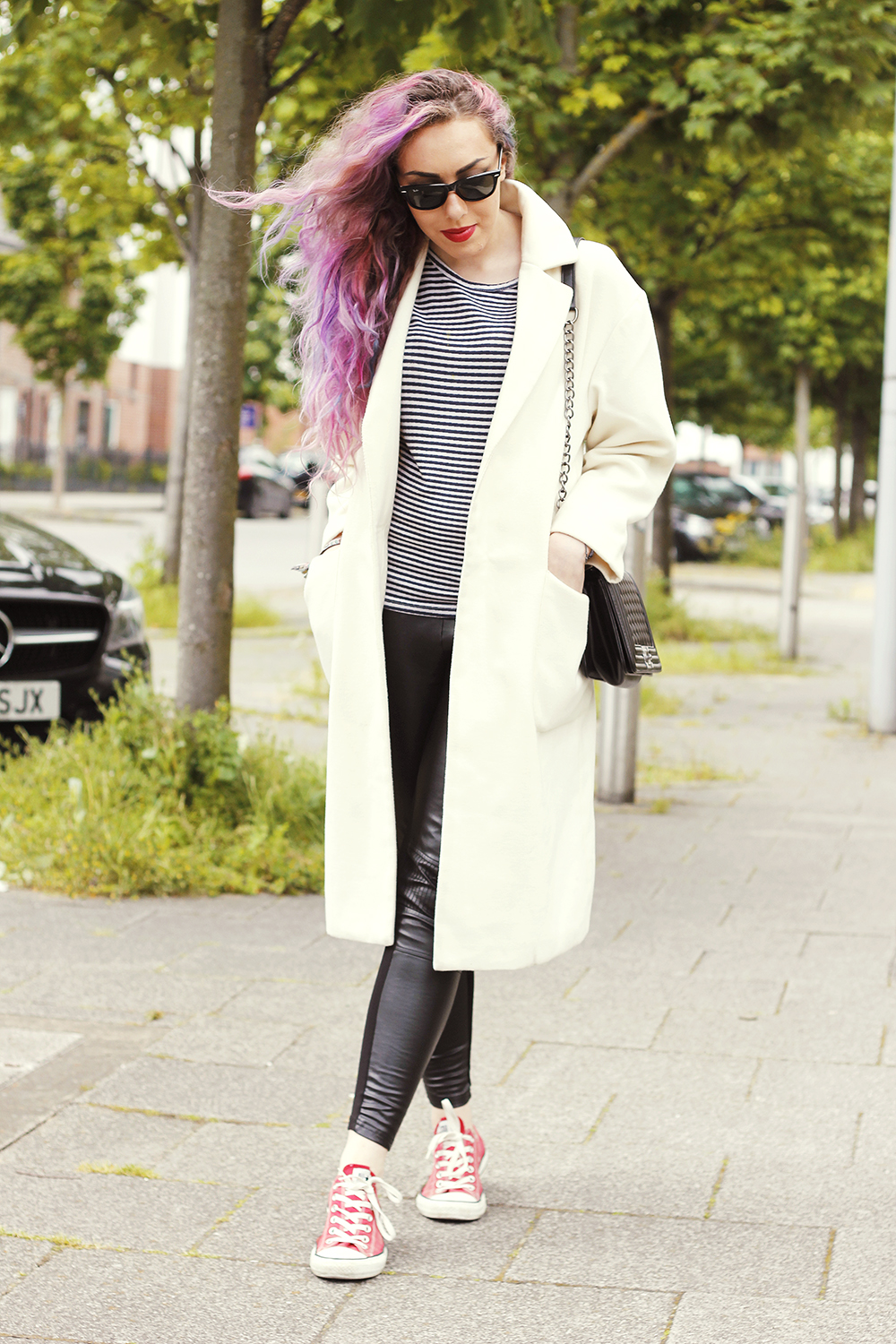 Street Style: Long White Coat, Stripe Top, Red Converse, Quilted Bag, Ray Ban Sunglasses