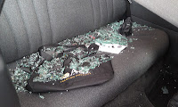 Shattered back windshield from Hurricane Sandy