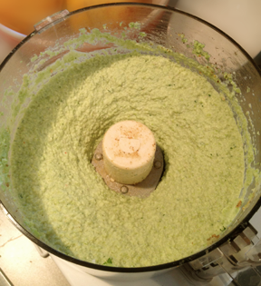 Edamame in food processor, blended with onions, garlic and spices.