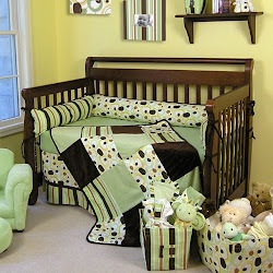 Crib set in greens and browns