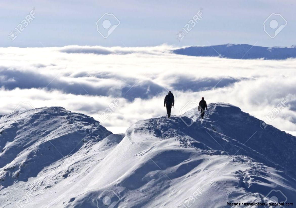 Two Climbers On A Mountain Top In Winter Piatra Craiului Two Climbers On A Mountain Top In Winter Piatra Craiului