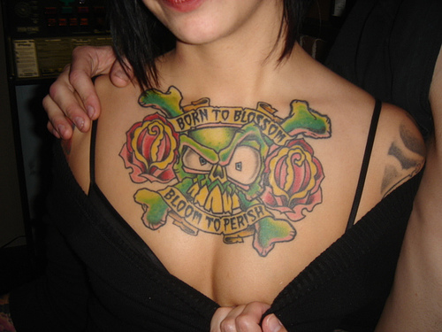 tattoos on girls necks. skull tattoo neck