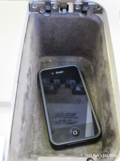 iPhone 4 in the small storage compartment.