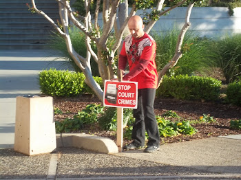 Protective Parent installs signage at a peaceful protest