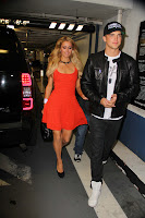Paris Hilton wearing orange dress