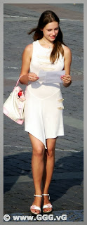 Girl in white summer dress on the street