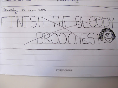 To do list for Thursday 18 June 2015 saying 'Finish the bloody brooches!' in large capital letters. It is crossed out and next to it is drawn a smiley face.