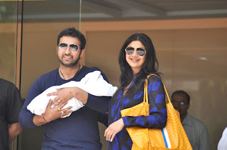 Shilpa Shetty and Raj Kundra pose with their son at hospital