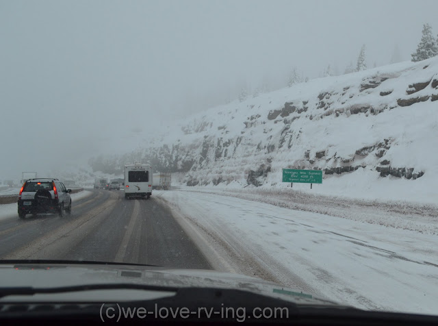 Sign shows the elevation and the winter roads