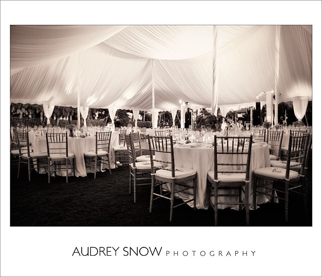 A lined tent draped poles too with great lighting and pretty linens to