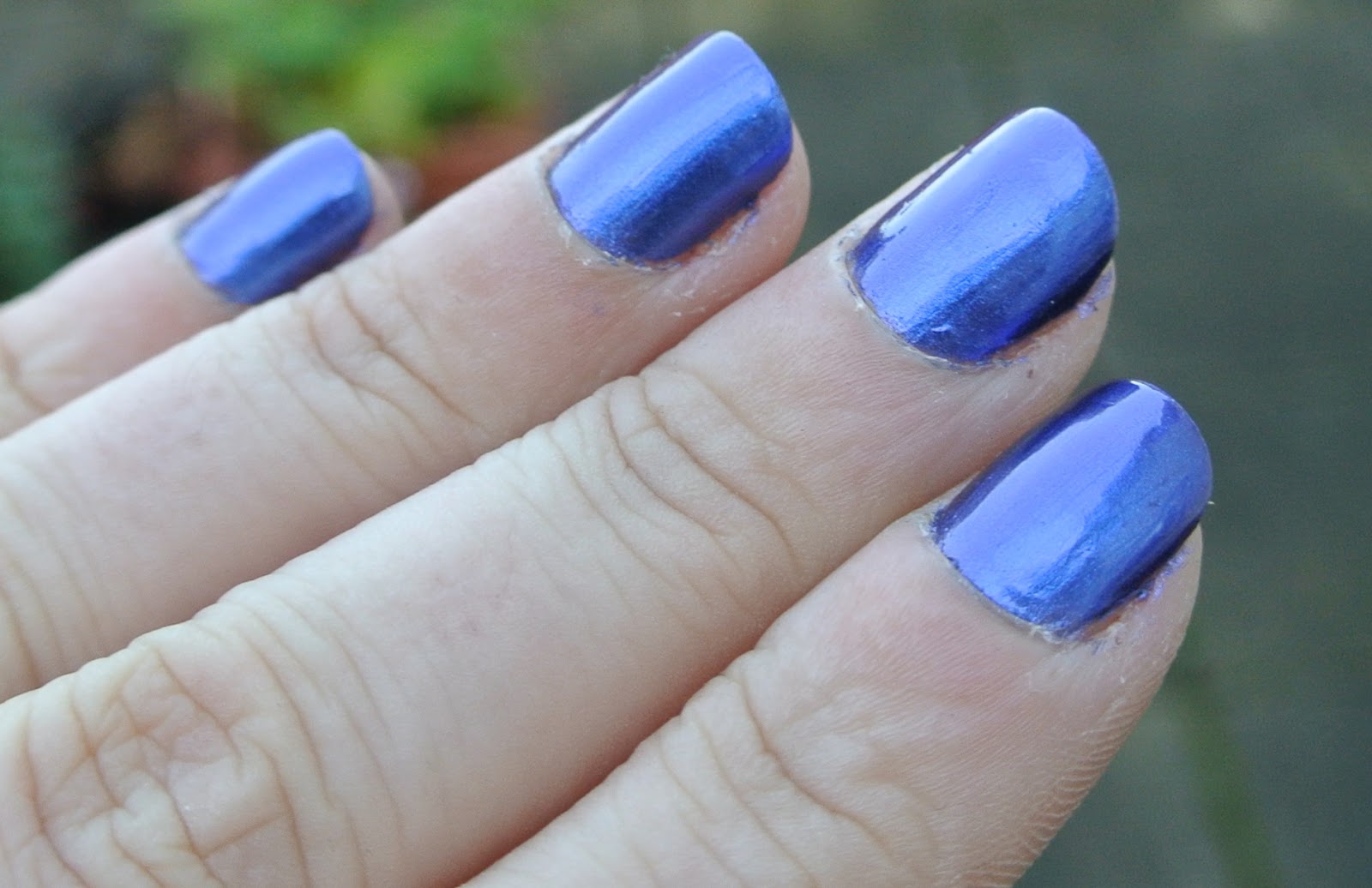 I love the metallic tint to it, nails inc. say it is: