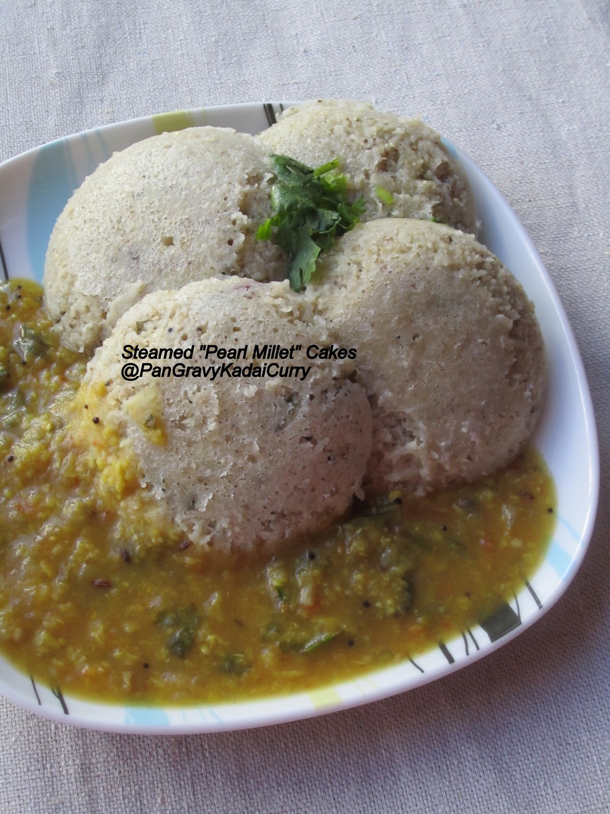 Pan Gravy Kadai Curry Steamed PearlMillet Cakes "Bajra/Kambu Idli" With Smashed Eggplant and