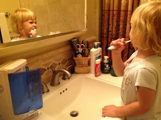 Little girl brushing teeth
