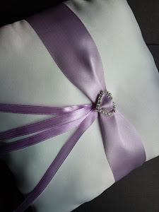 ring cushion with lilac ribbon and silvert heart, only £8.50.