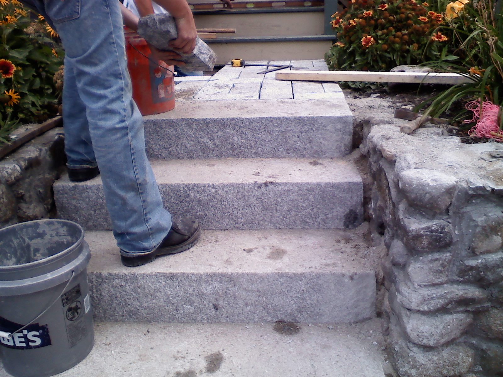 RL Sanborn Masonry Solid granite steps installation with cobblestone