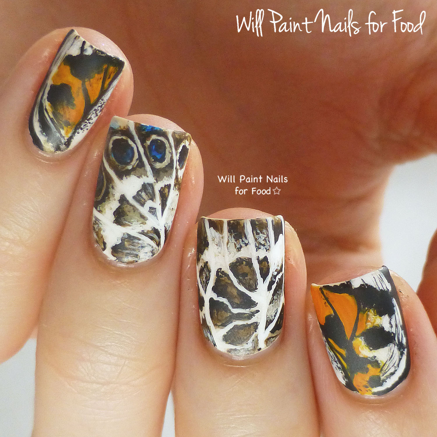 Freehand butterfly nail art