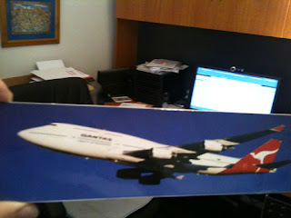 a poster of a plane on a desk