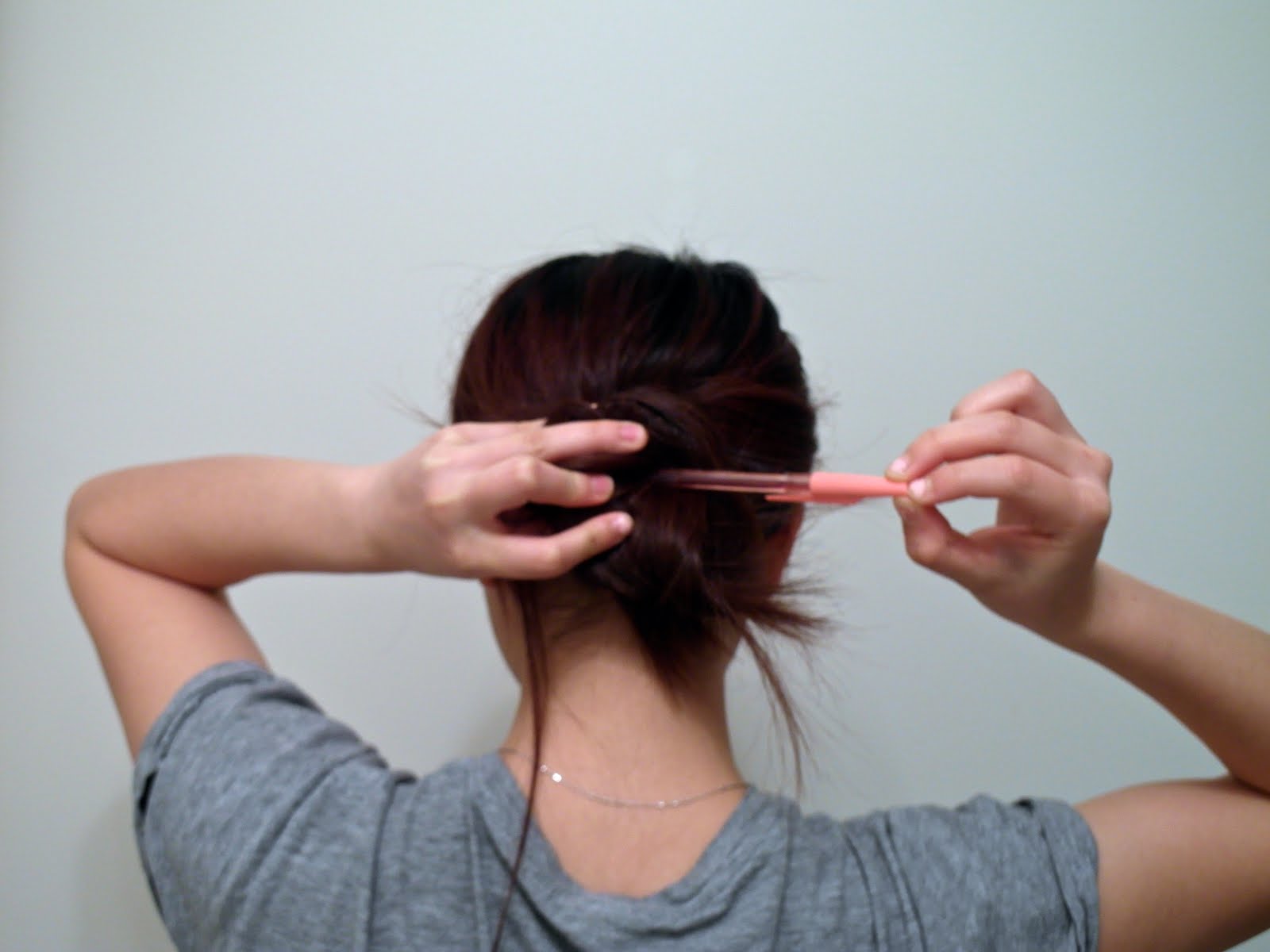 How to tie your hair with just a pen.