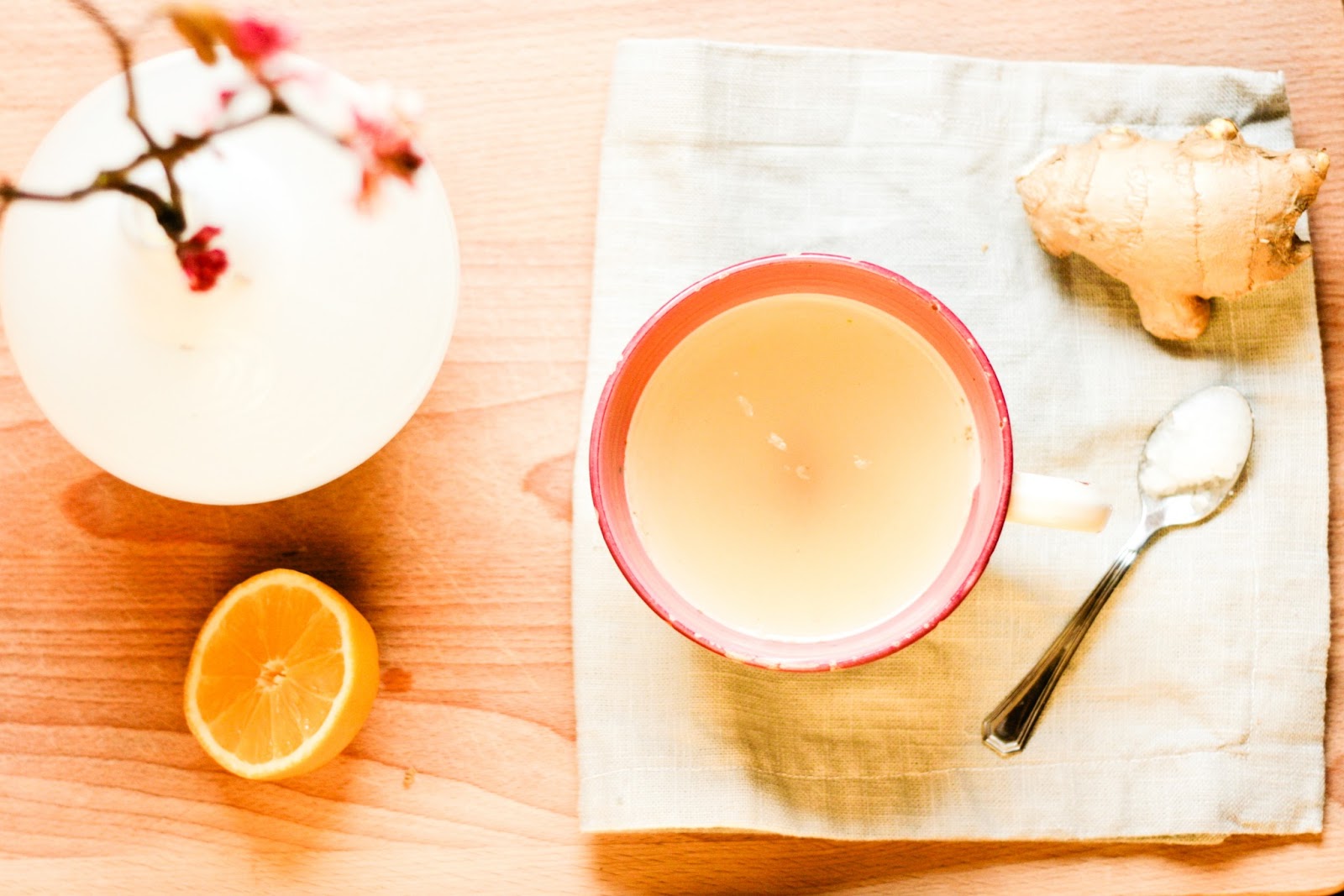 A wholesome energy drink Gingerlemon tea with coconut oil FRONT DOOR HIPPIE