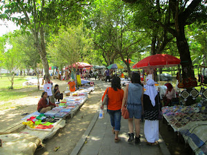 Souvenir hawkers line the road on the exit from Borobudur temple.