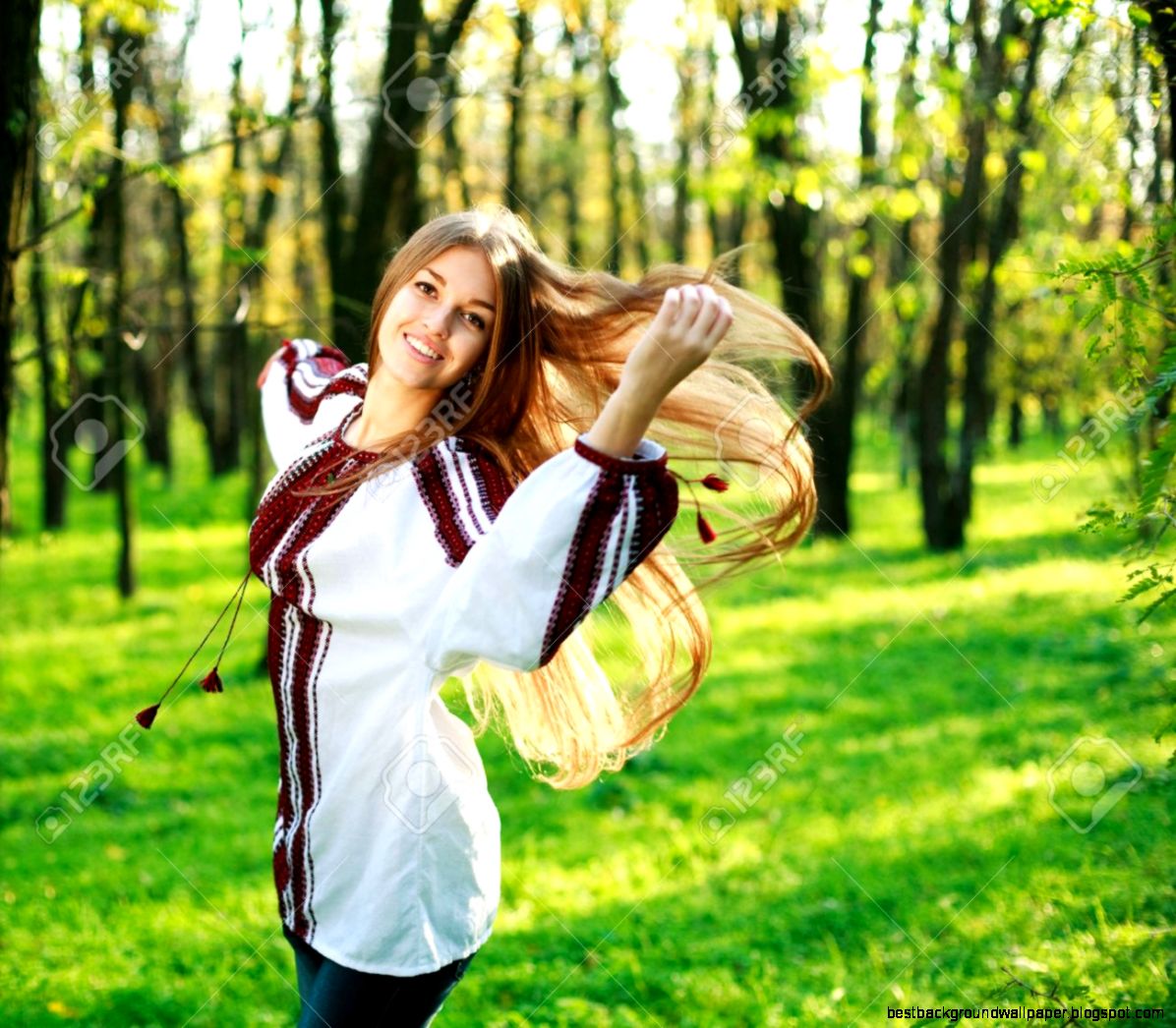 Smiling Cute Girl With Long Hair Dancing In Green Park Stock Photo Smiling Cute Girl With Long Hair Dancing In Green Park Stock Photo