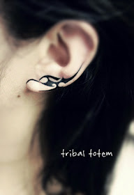 a tribal totem on the ear