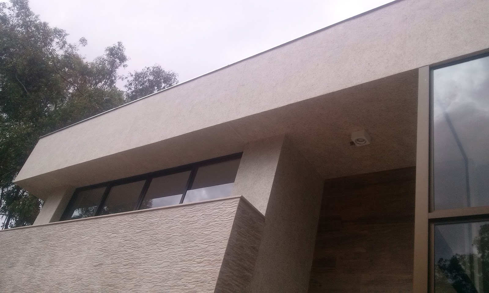 Eco granito na fachada. Pintura de casas.