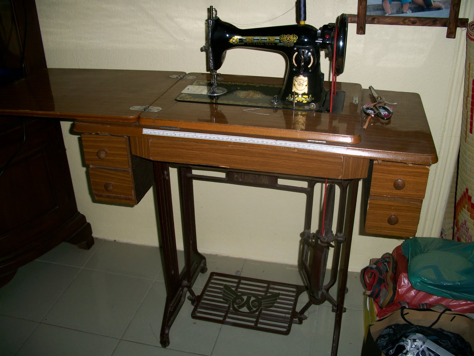 collectible items Vintage Flying Man Sewing Machine