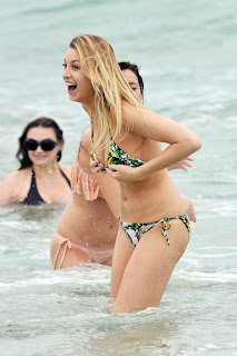 Whitney Port can barely keep her curvy assets in a bikini