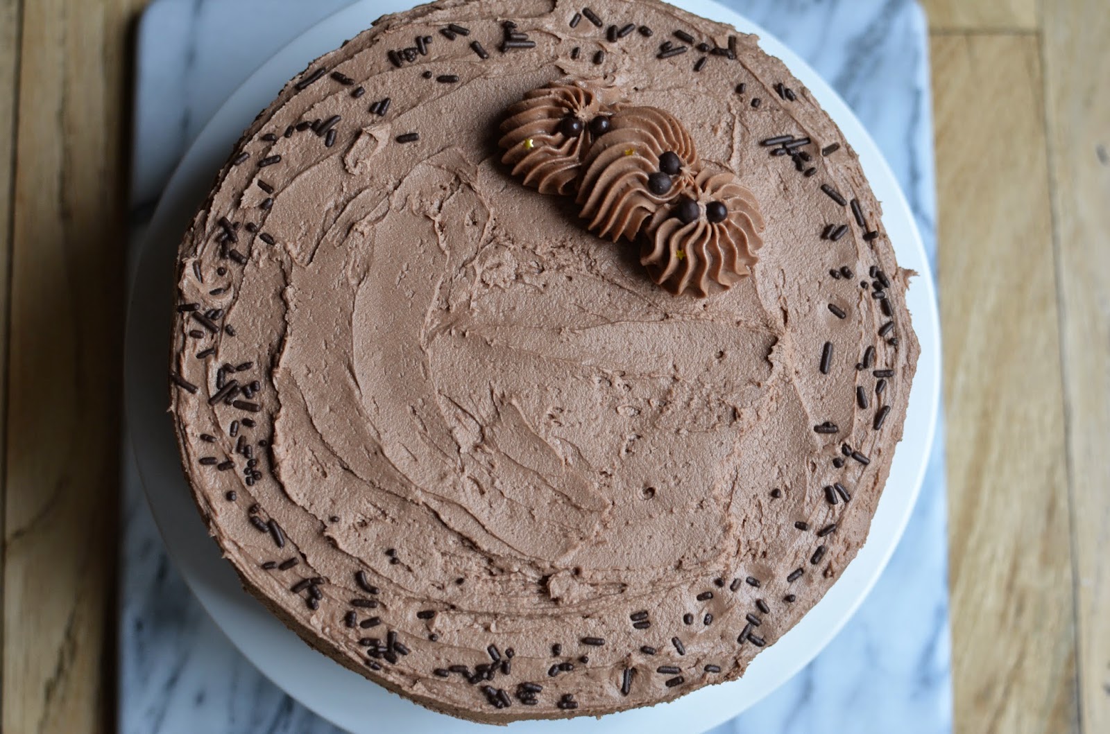 Playing with Flour Vanilla layer cake with chocolate buttercream frosting