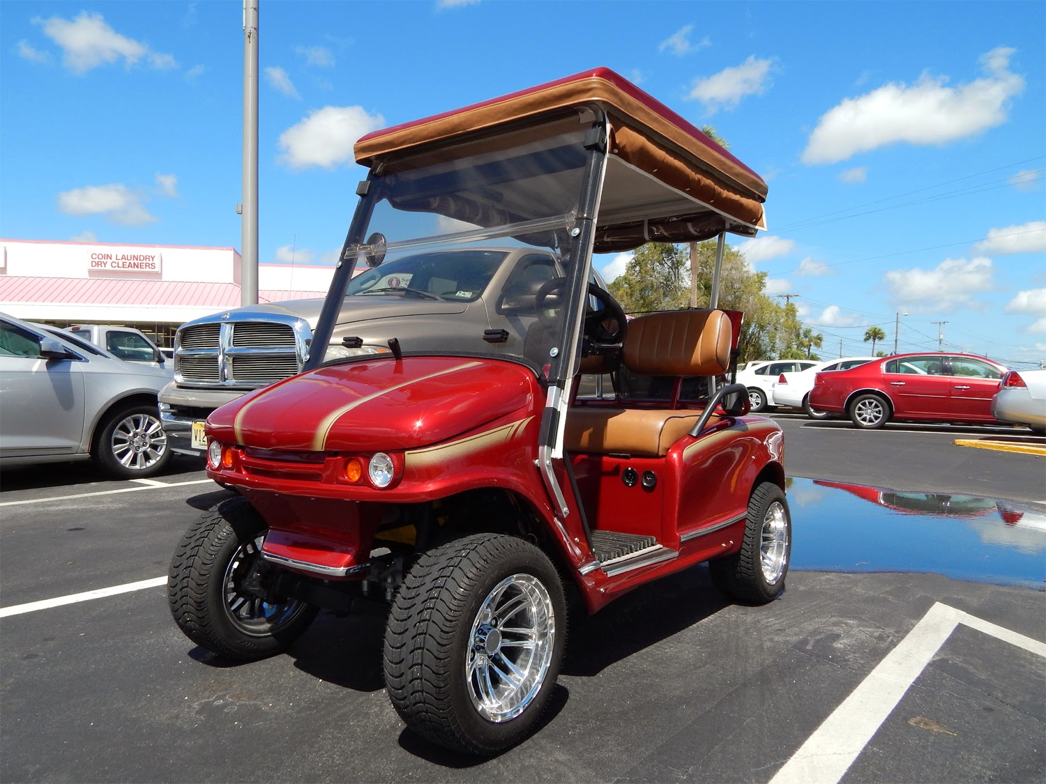 Red Western 400 Model Golf Cart with ITP tires in Sun City Center Plaza