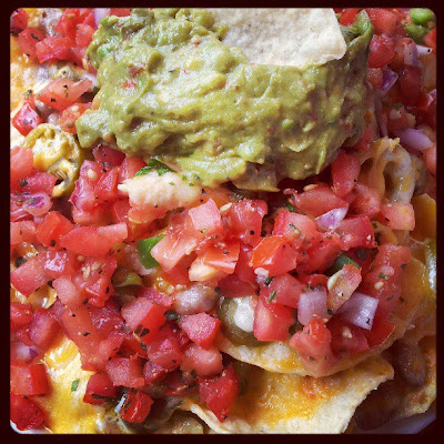 nachos with fresh tomatoes, pinto beans and chiles