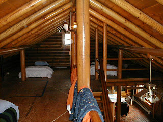 old sleeping loft in "kit" log home, https://huismanconcepts.com/