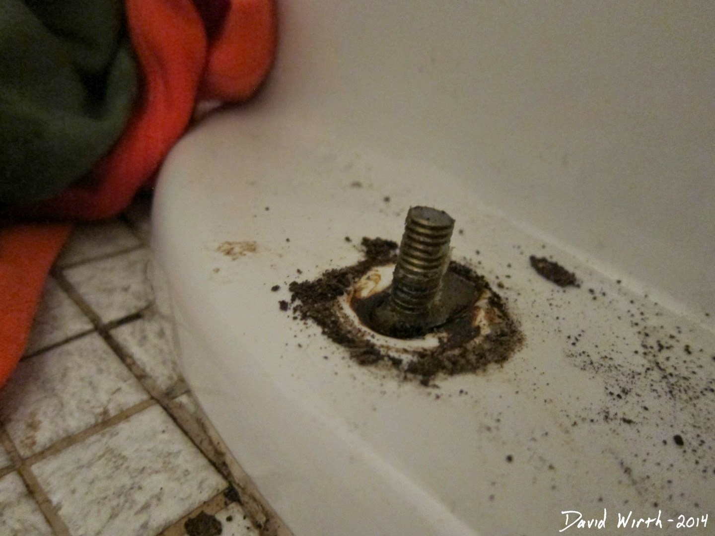 how to remove toilet bolt, rusted