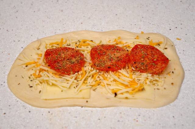 Dough Oval With Cheese and Pepperoni