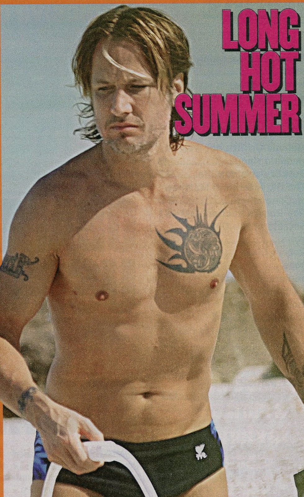 Keith Urban in black speedos at the beach: Hot Musician's hot bod.