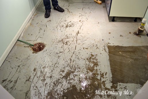 basement laundry floor drain tiling dirty water paint