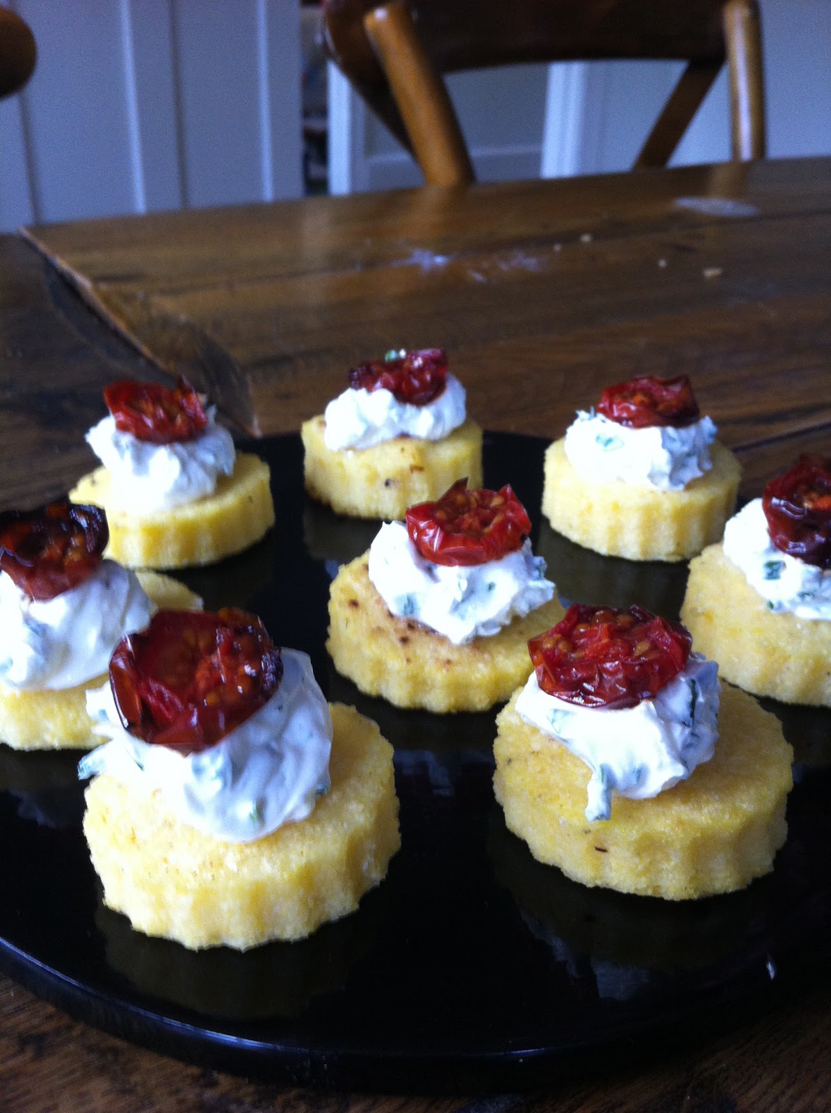 Aga Girls Polenta, goat's cheese and roasted cherry tomato canapes.