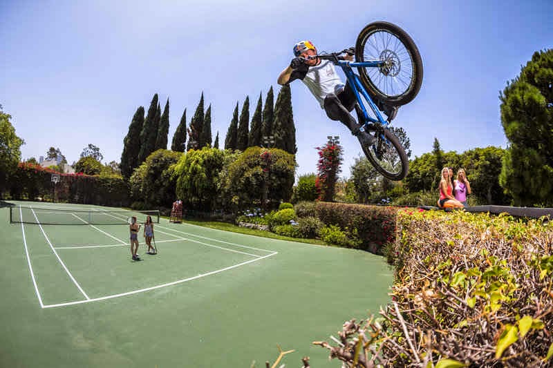 Watch: Red Bull's stunt cycle around Playboy mansion and other hot