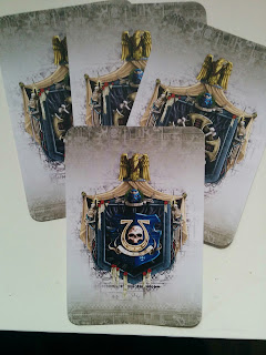 4 cards with Ultramarine iconography laid in an overlapping pattern