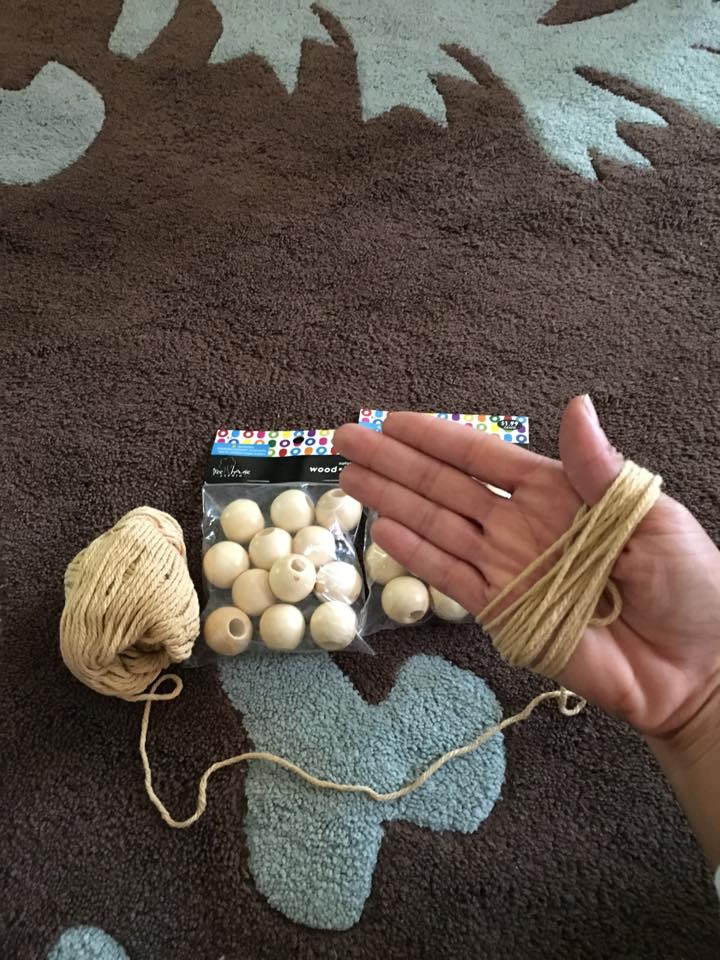 Then I started stringing the beads. I had a very enthusiastic little